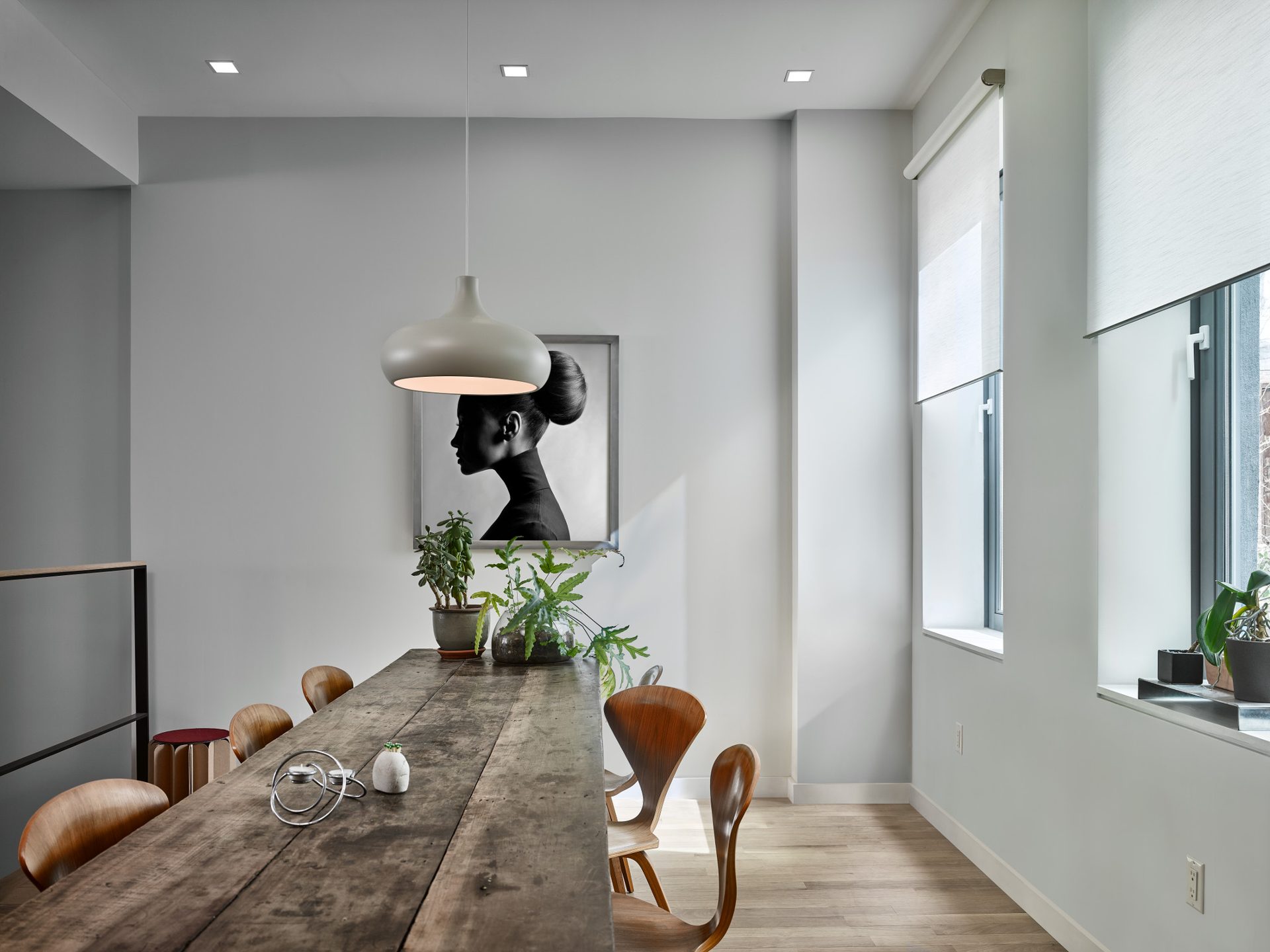 Luxury bedroom with motorized drapes and automated daylight control