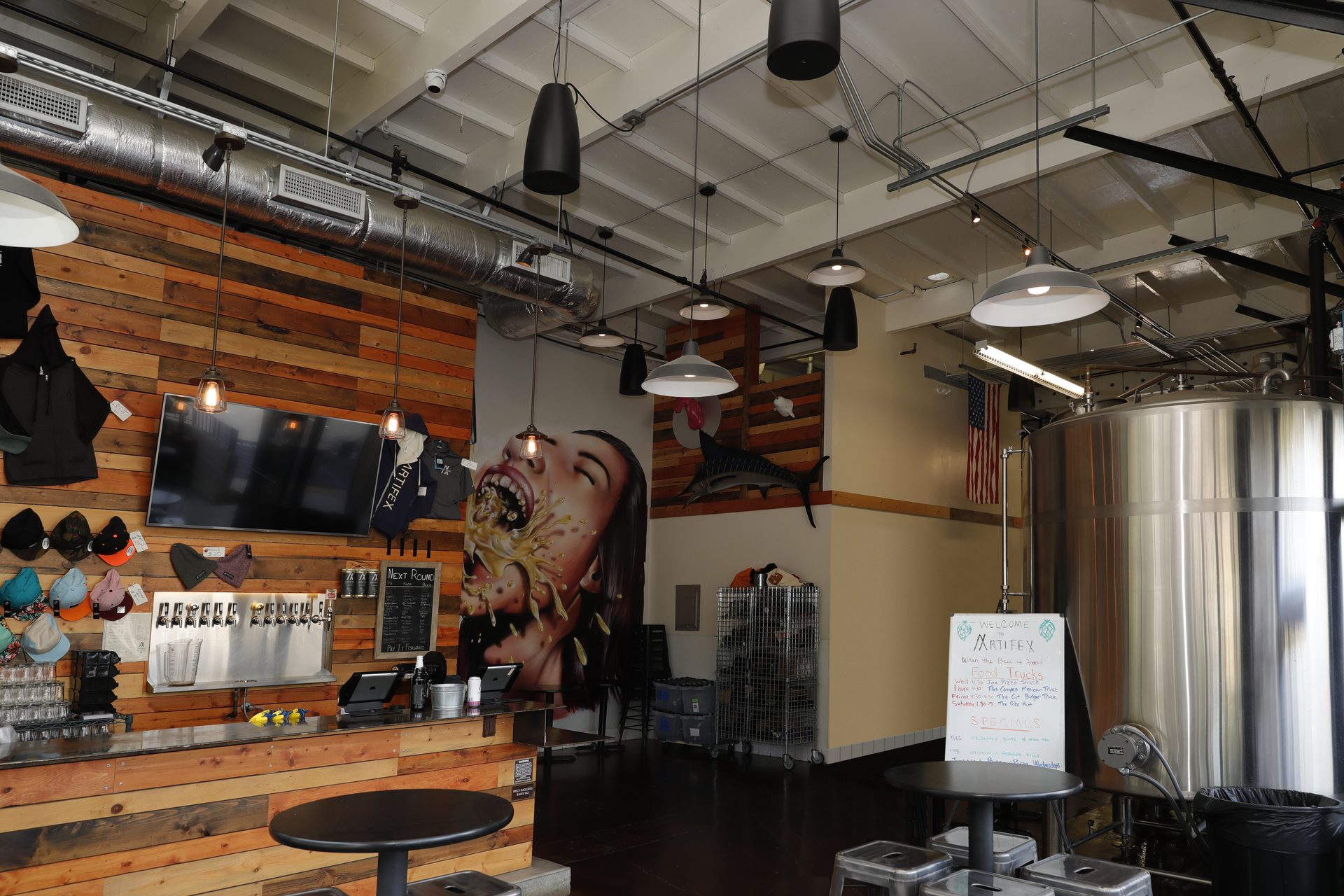 Lakehouse living room with in-ceiling architectural speakers and waterfront view