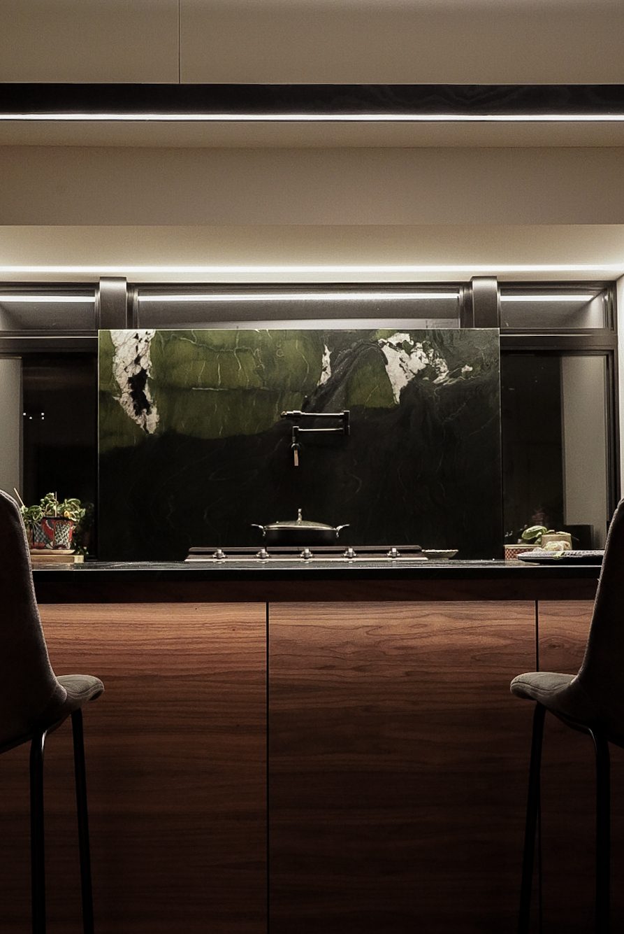 Modern living room with floor-to-ceiling windows and automated shading